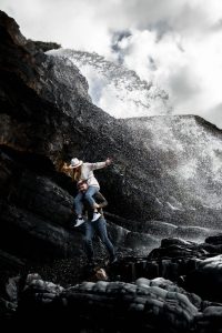 Couple at Sandymouth beach near fountain.